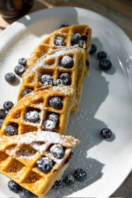 Waffles topped with fresh blueberries