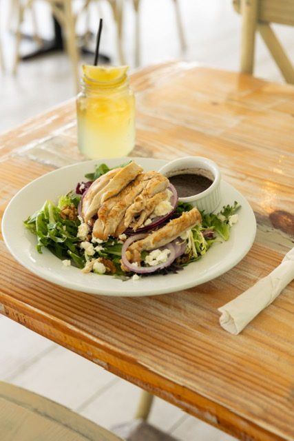 Grilled chicken salad with feta and red onion